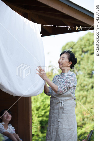 Grandmother grandson laundry housework 34237569