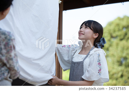 Grandmother grandson laundry housework 34237585