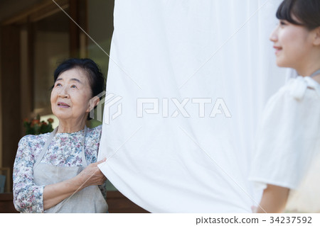 Grandmother grandson laundry housework 34237592