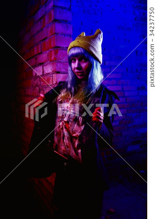 Portrait of funny zombie girl in halloween time Portrait of funny zombie girl in halloween time 34237750