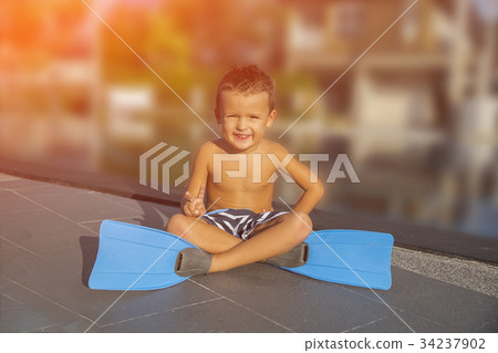 Little boy in a flippers for diving 34237902
