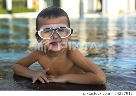 A happy young boy relaxing A happy young boy relaxing 34237912