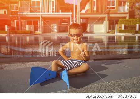 Little boy in a flippers for diving Little boy in a flippers for diving 34237913
