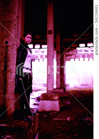 Woman killer holding Japanese sword on a post-apocalyptical landscape Woman killer holding Japanese sword on a post-apocalyptical landscape 34238401