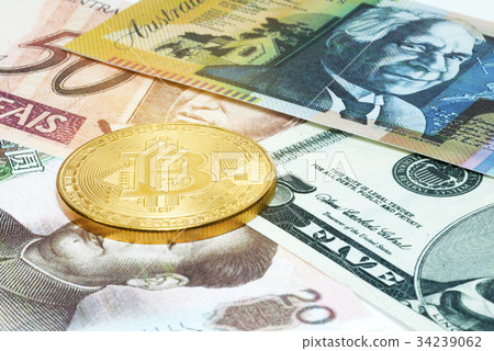 Golden Bitcoin coin on close up 34239062