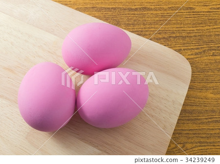 Three Pink Century Egg on Wooden Board Three Pink Century Egg on Wooden Board 34239249