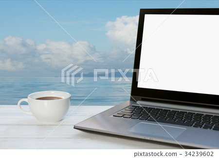 Outdoor workspace,computer notebook and coffee  34239602