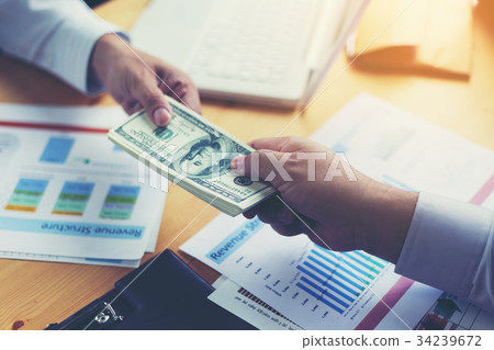Businessmen are paying compensation to partners 34239672