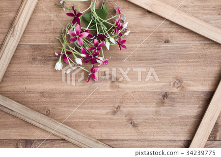 Wooden frame decoration with Rangoon creeper or Qu Wooden frame decoration with Rangoon creeper or Qu 34239775