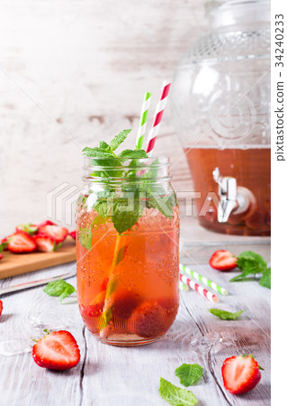 Glass jar with homemade strawberry compote 34240233