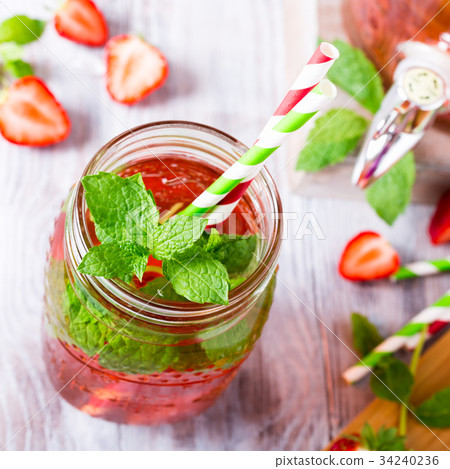 Glass jar with homemade strawberry compote Glass jar with homemade strawberry compote 34240236