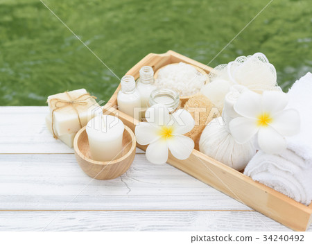 Spa wellness,candle,milk soap,salt,towel,flowers 34240492