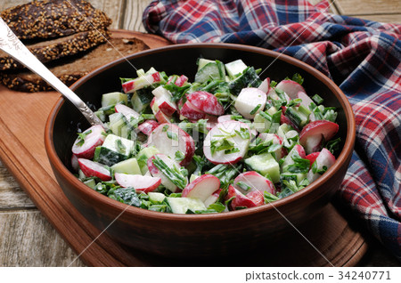 Salad from radish and cucumber Salad from radish and cucumber 34240771