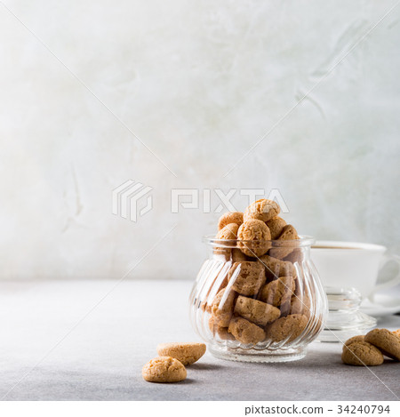 Amaretti cookies with white cup of coffee 34240794