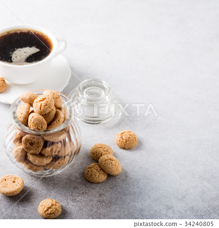 Amaretti cookies with white cup of coffee 34240805