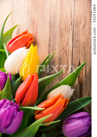 Colorful tulips on old wooden background Colorful tulips on old wooden background 34241064