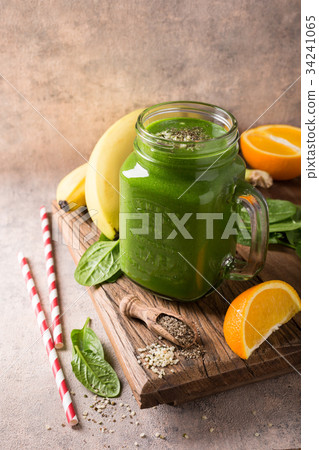 Healthy green smoothie with spinach in glass jar Healthy green smoothie with spinach in glass jar 34241065