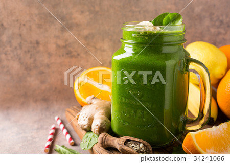 Healthy green smoothie with spinach in glass jar Healthy green smoothie with spinach in glass jar 34241066
