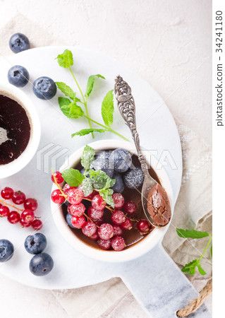Chocolate dessert with berries 34241180
