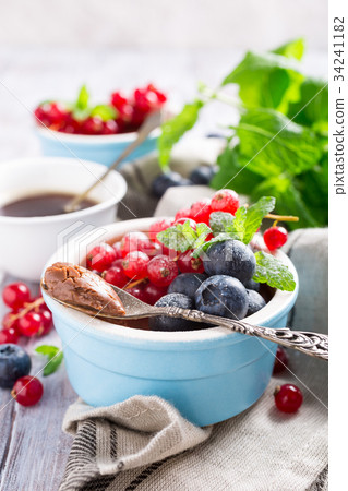 Chocolate dessert with berries 34241182