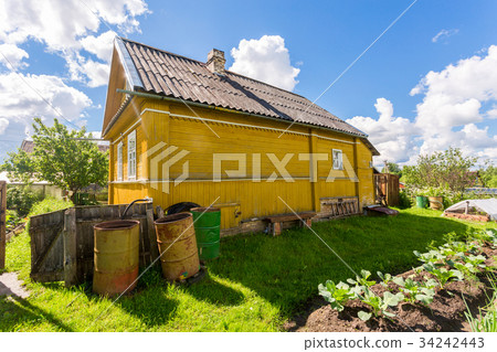 Rural landscape with small wooden house Rural landscape with small wooden house 34242443