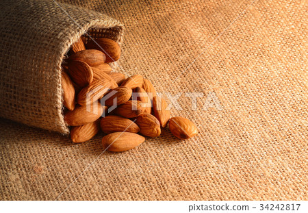 Almonds on the sack background. Organic food. 34242817