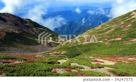 Serizawa curl and mountain hut near the summit of Senjogatake Serizawa curl and mountain hut near the summit of Senjogatake 34247575