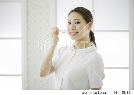 White coat woman and toothbrush White coat woman and toothbrush 34258618
