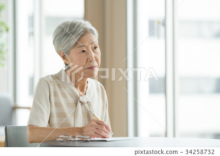Senior letter woman writing lifestyle image 34258732