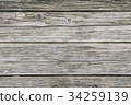 old pale grey wood board with cracks and knots 34259139