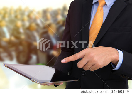 business man holding tablet and using touchpad business man holding tablet and using touchpad 34260339