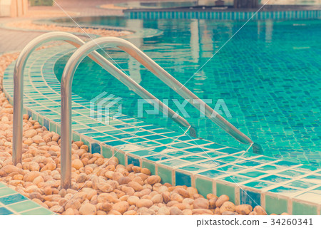 blue swimming pool at hotel with stair 34260341