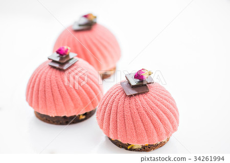 Three pink cupcake background on white Three pink cupcake background on white 34261994