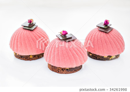 Three pink cupcake background on white Three pink cupcake background on white 34261998