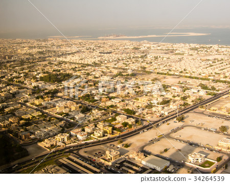 The shadow of the high-rise building reflected in the cityscape in the sandbox seen from the high-rise hotel in Dubai and the sea seen in the distance The shadow of the high-rise building reflected in the cityscape in the sandbox seen from the high-rise hotel in Dubai and the sea seen in the distance 34264539