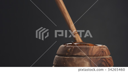 honey pot and dipper with gray background 34265460