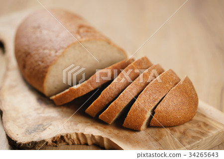 rye wheat rustic bread on cutting board rye wheat rustic bread on cutting board 34265643
