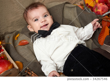 autumn season, child boy lie on yellow fall leaves 34267546