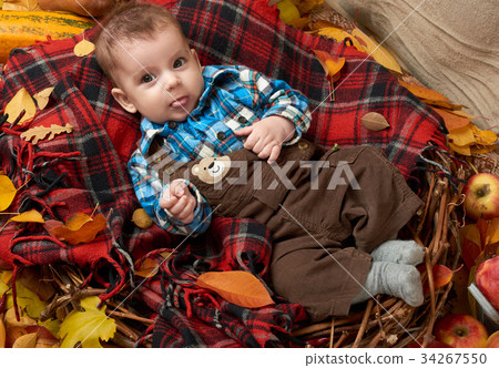 autumn season, child boy lie on yellow fall leaves autumn season, child boy lie on yellow fall leaves 34267550