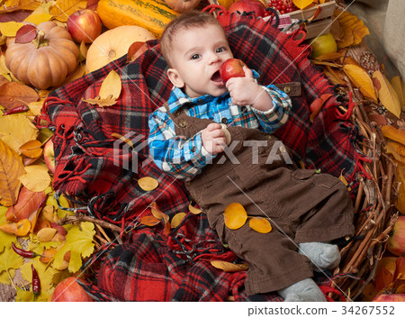 autumn season, child boy lie on yellow fall leaves 34267552