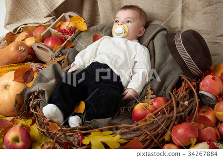 autumn season, child boy lie on yellow fall leaves autumn season, child boy lie on yellow fall leaves 34267884