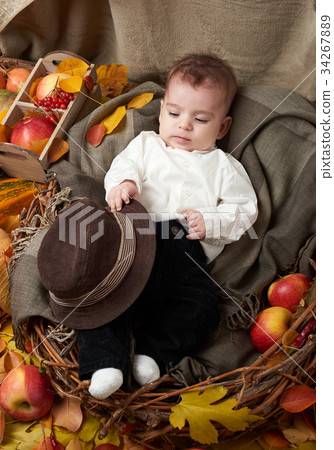 autumn season, child boy lie on yellow fall leaves autumn season, child boy lie on yellow fall leaves 34267889