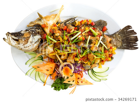 Plate of grilled fish with vegetables - isolated Plate of grilled fish with vegetables - isolated 34269171