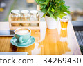 Coffee and tea cup on the table in a coffee shop. 34269430