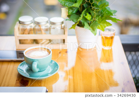 Coffee and tea cup on the table in a coffee shop. 34269430
