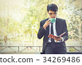 Young businessmen are looking at report paper 34269486