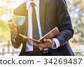 Young businessmen are looking at report paper 34269487