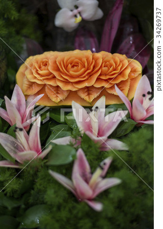 Thai fruit carving and food garnish on papaya 34269737