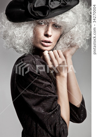 Cloe-up portrait of a woman performing on a fashion show Cloe-up portrait of a woman performing on a fashion show 34270004