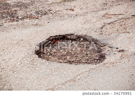 Bad road with deep pit. Russia problem. Bad road with deep pit. Russia problem. 34270991